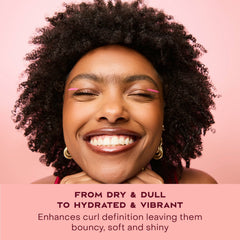SheaMoisture being applied to damp hair in sections demonstrating controlled styling and frizz reduction