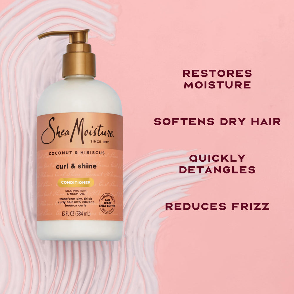 SheaMoisture applying conditioner to curly hair to detangle and soften