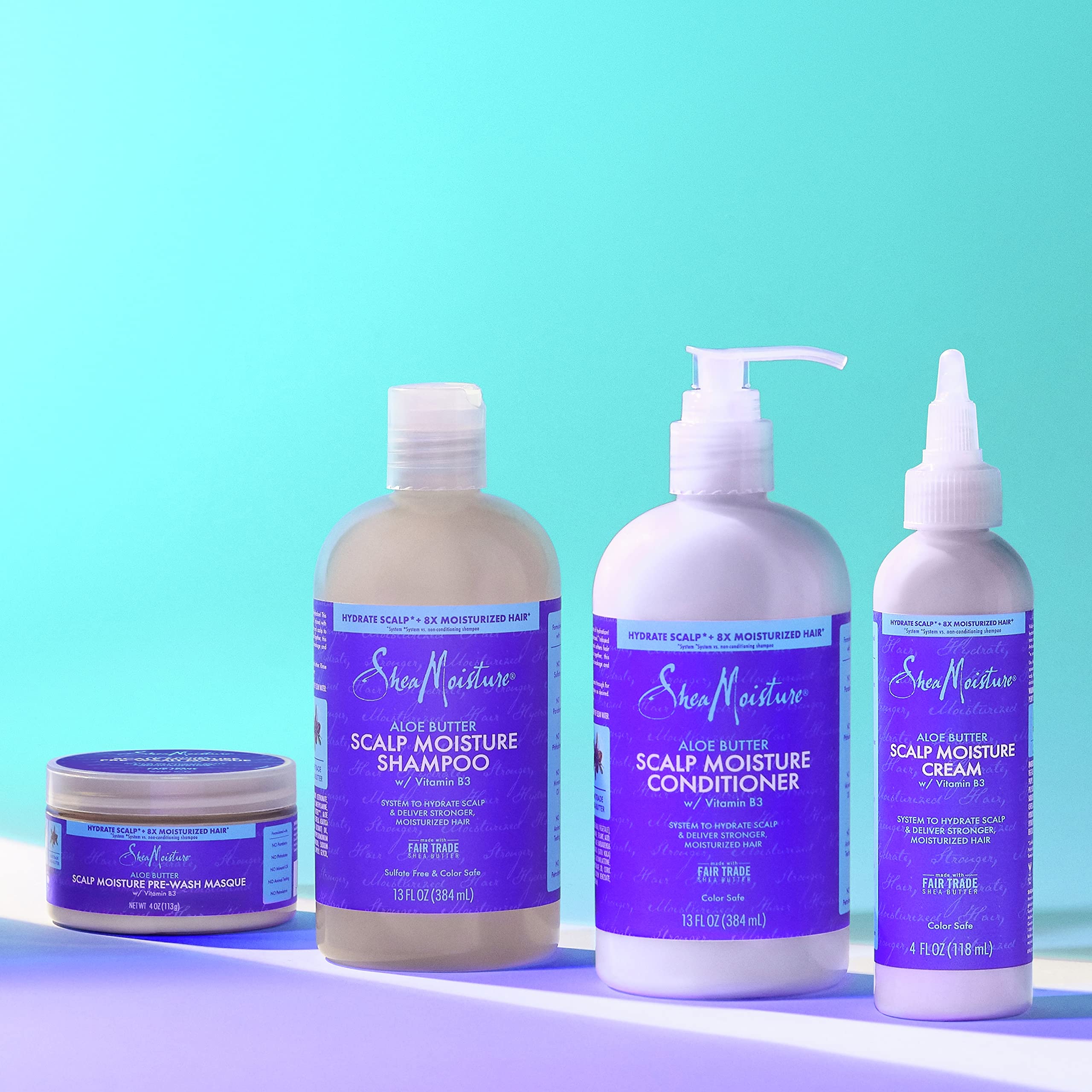 SheaMoisture shampoo bottle paired with conditioner for complete system