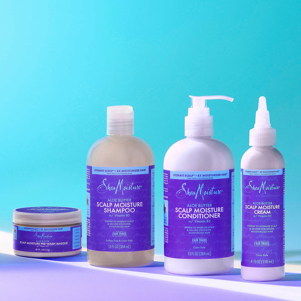 SheaMoisture shampoo bottle paired with conditioner for complete system
