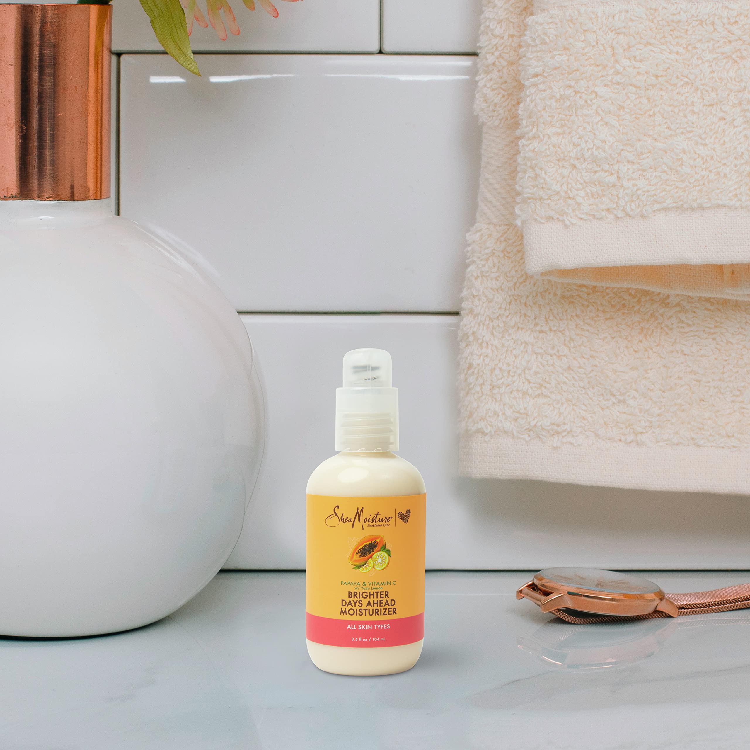 SheaMoisture close detail of iridescent finish conveying luminous skin effect