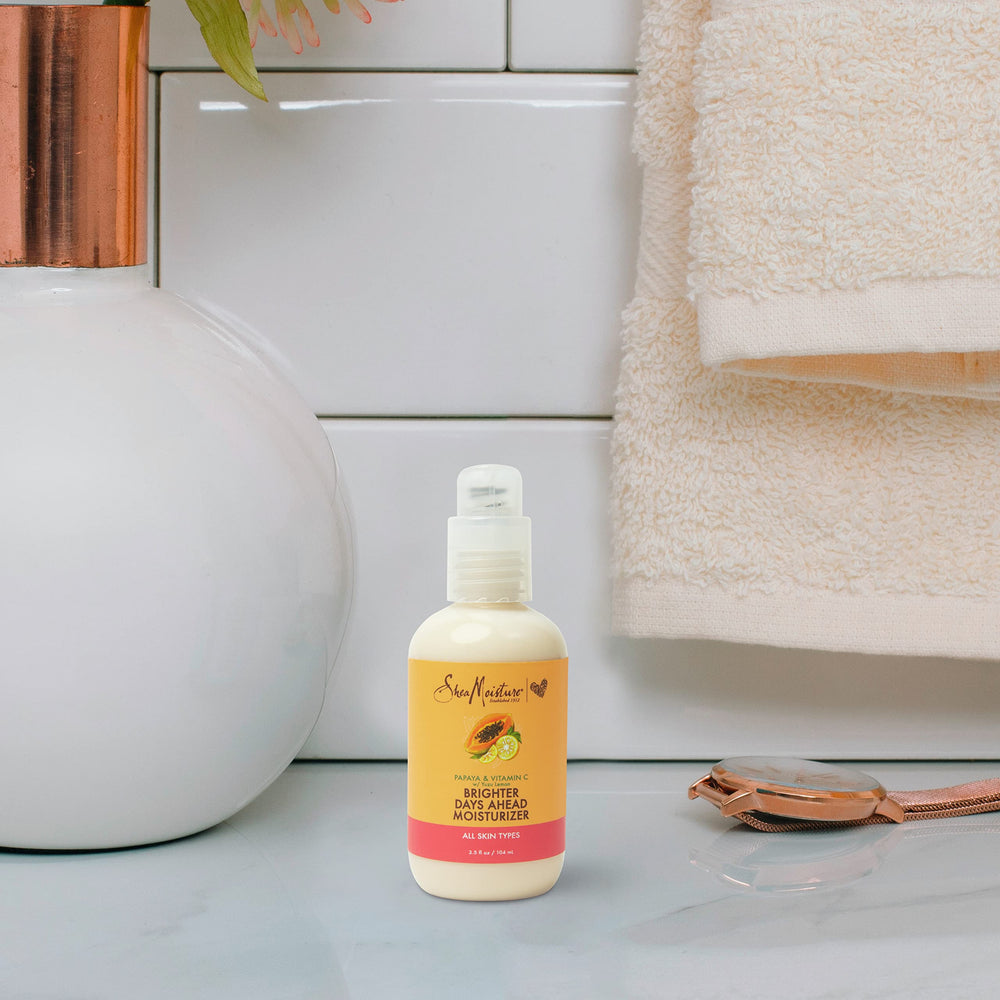 SheaMoisture close detail of iridescent finish conveying luminous skin effect