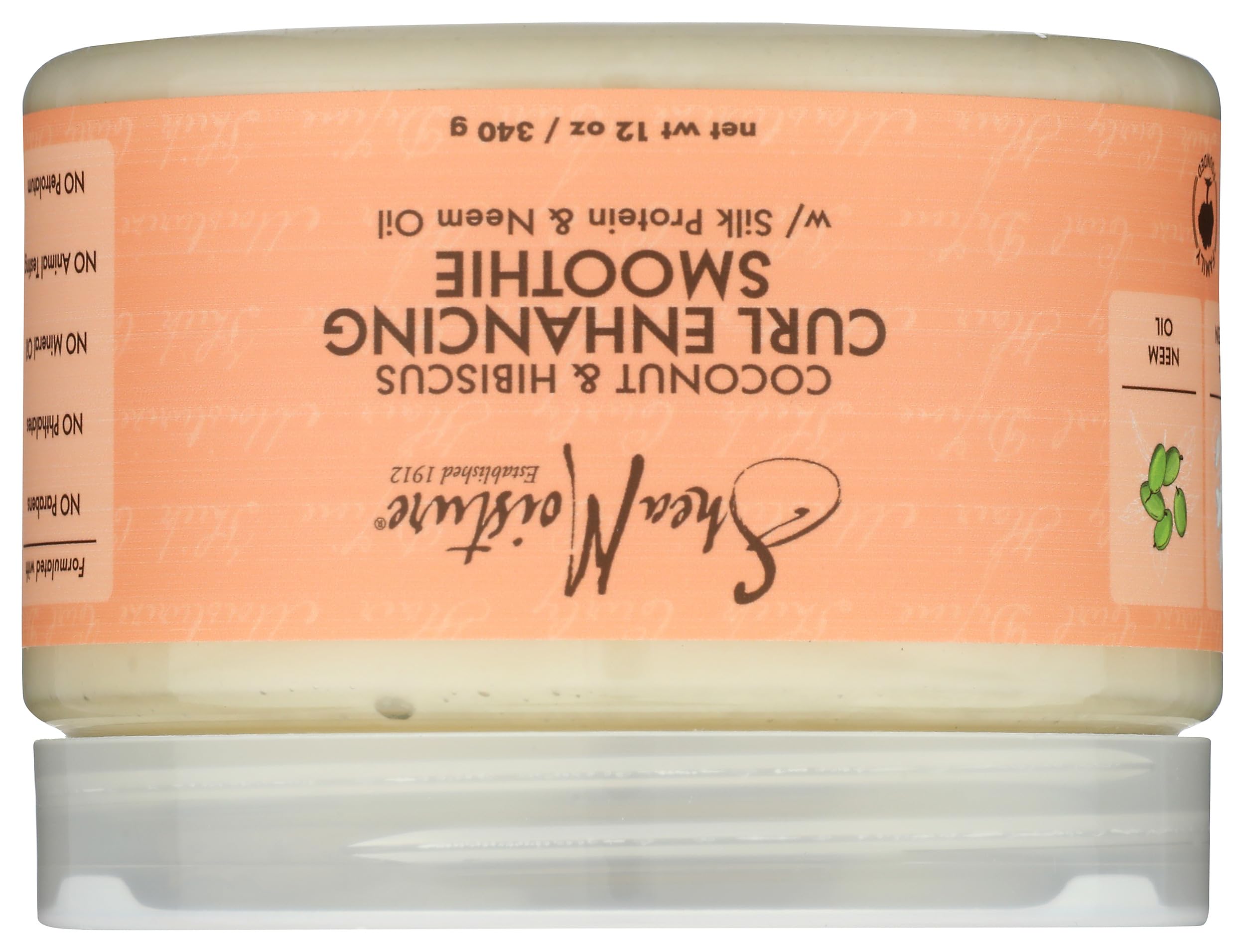 SheaMoisture jar held in hand to show 12 oz scale and easy handling benefit