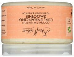 SheaMoisture jar held in hand to show 12 oz scale and easy handling benefit