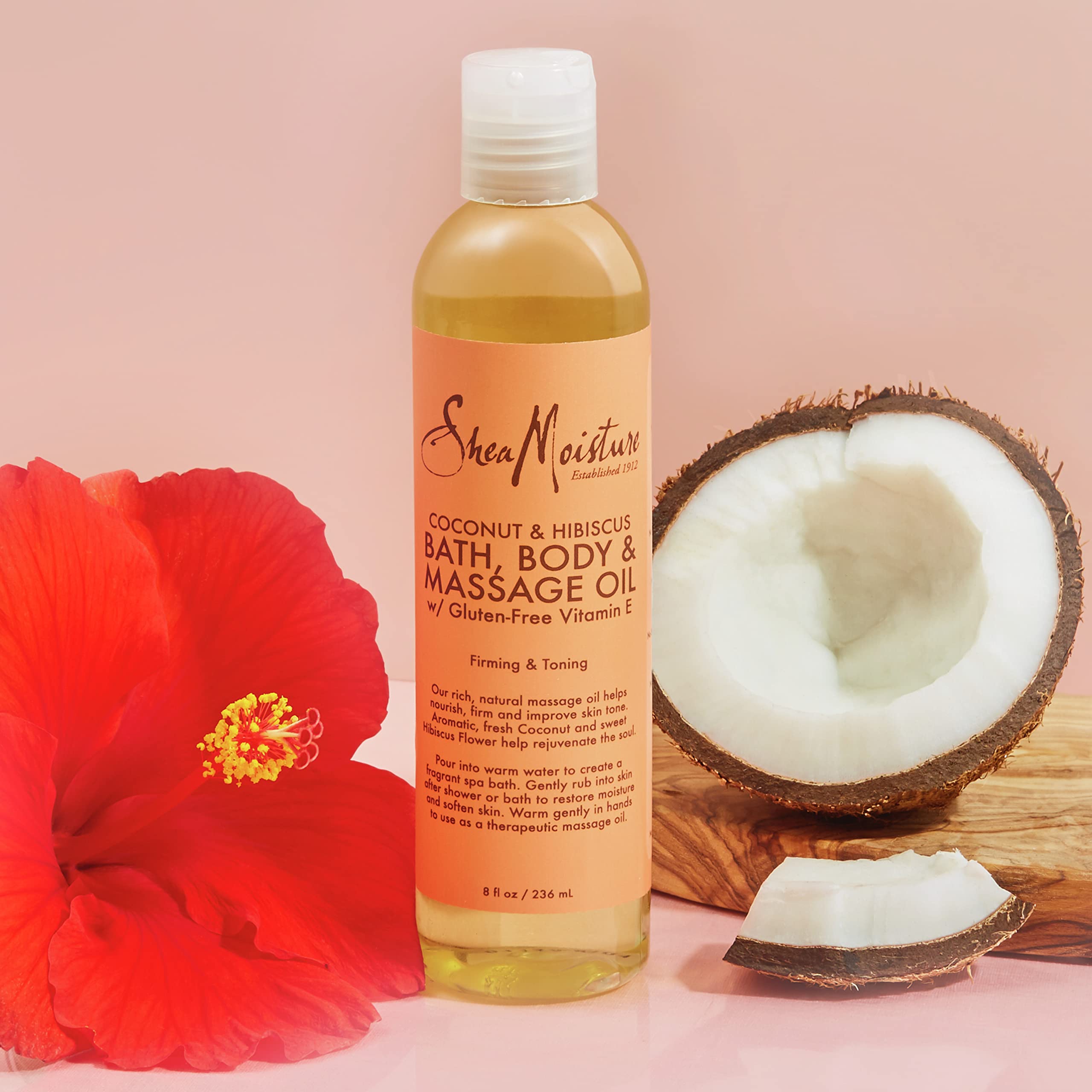 Shea Moisture coconut and hibiscus ingredients arranged to show freshness