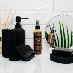 Shea Moisture toner on bathroom shelf suggesting daily routine benefit