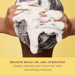 SheaMoisture shampoo on curly hair in shower demonstrating slip