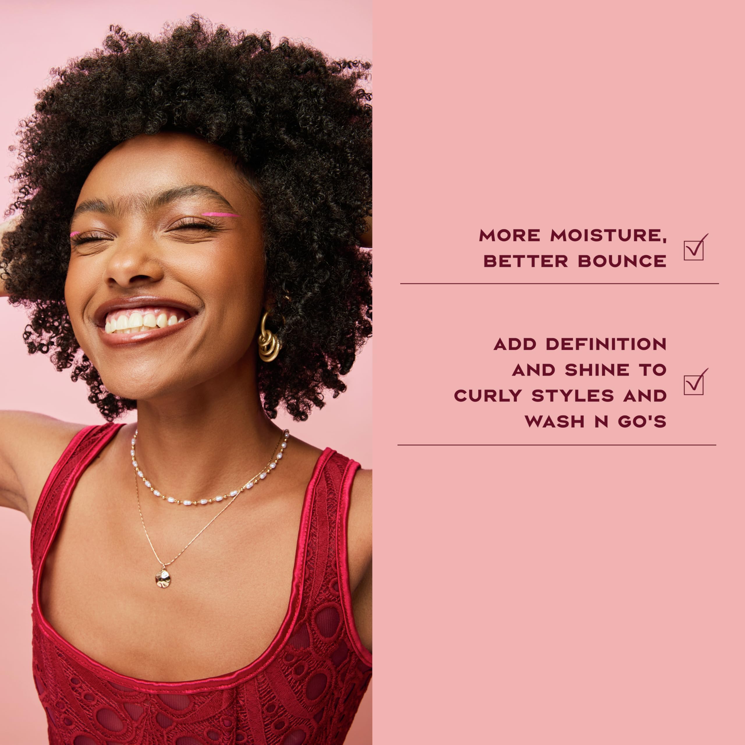 Shea Moisture 8 oz bottle in hand showing portable size and convenience benefit