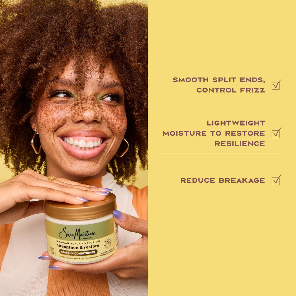 SheaMoisture bottle held in hand to show 11.5 oz scale and convenience