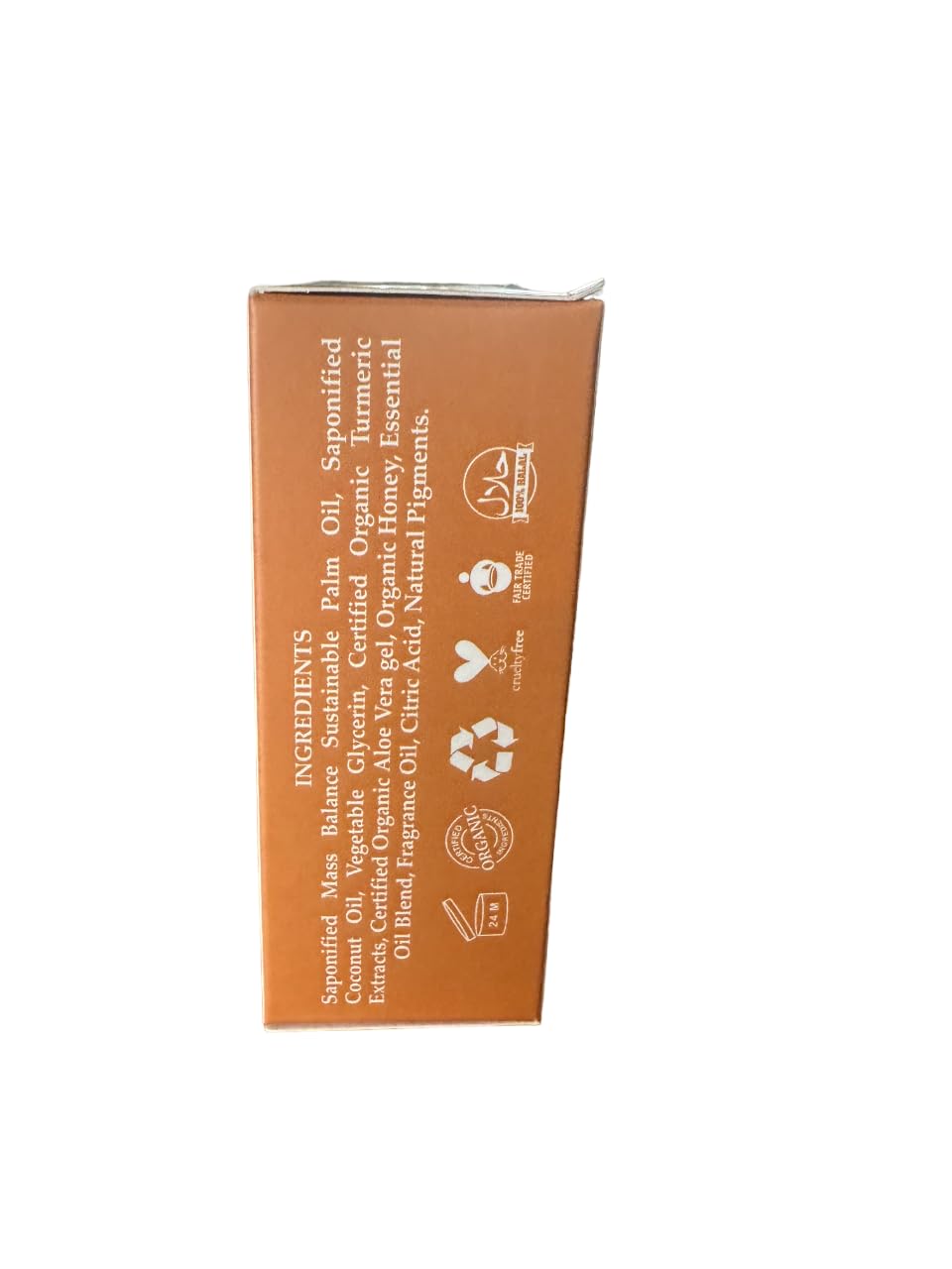 SheaOlein turmeric soap on bathroom shelf styled to suggest daily use