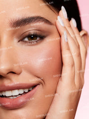 SHEGLAM pencil held in hand illustrating compact travel-friendly size