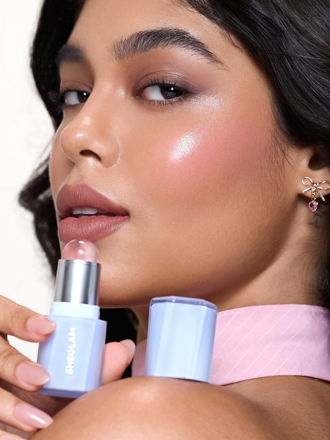 SHEGLAM blush stick next to lipstick showing compact, travel-friendly size