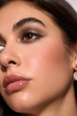 SHEGLAM Bronze Dust applied on eyelid with brush showing easy application benefit