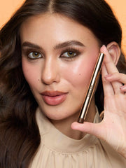 SHEGLAM brown pencil next to makeup bag highlighting travel-friendly convenience