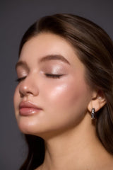 SHEGLAM on model in evening makeup illustrating luminous long-lasting shimmer