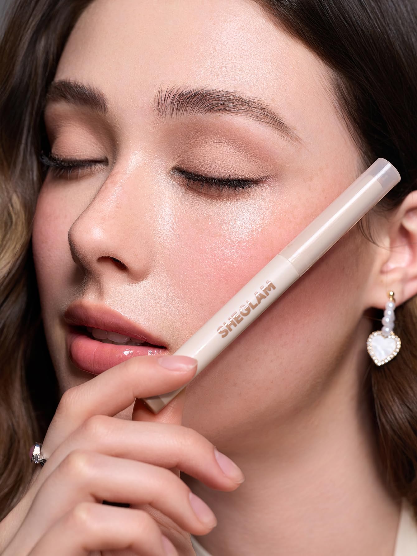 SHEGLAM creamsicle stick in use demonstrating easy crease-free application