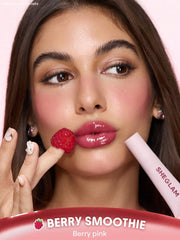 SHEGLAM gloss on model lips showing sheer berry color and high shine benefit