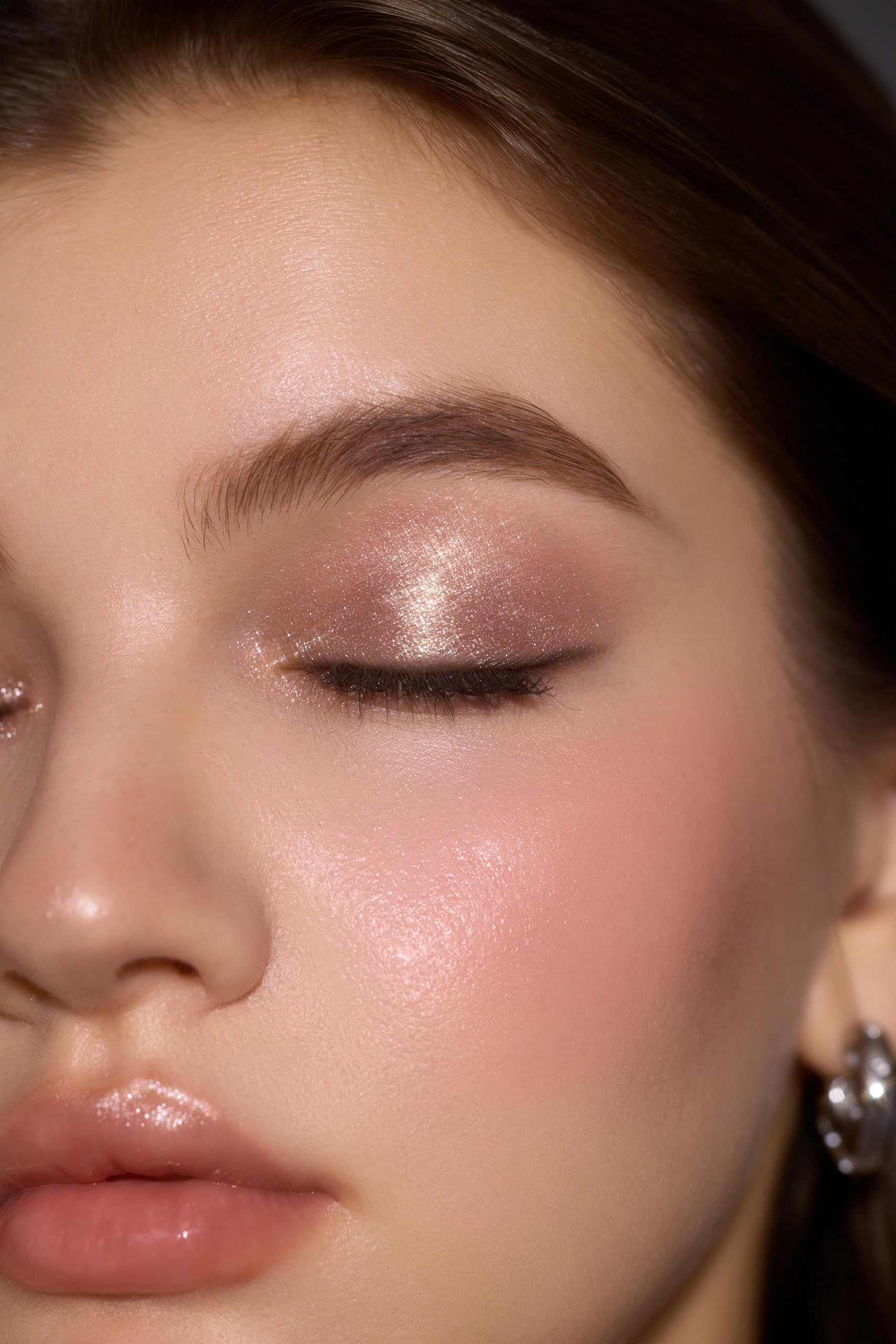SHEGLAM applied on eyelid in lifestyle scene adding instant lift and sparkle