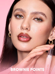SHEGLAM next to a coin for scale indicating compact, travel-friendly size