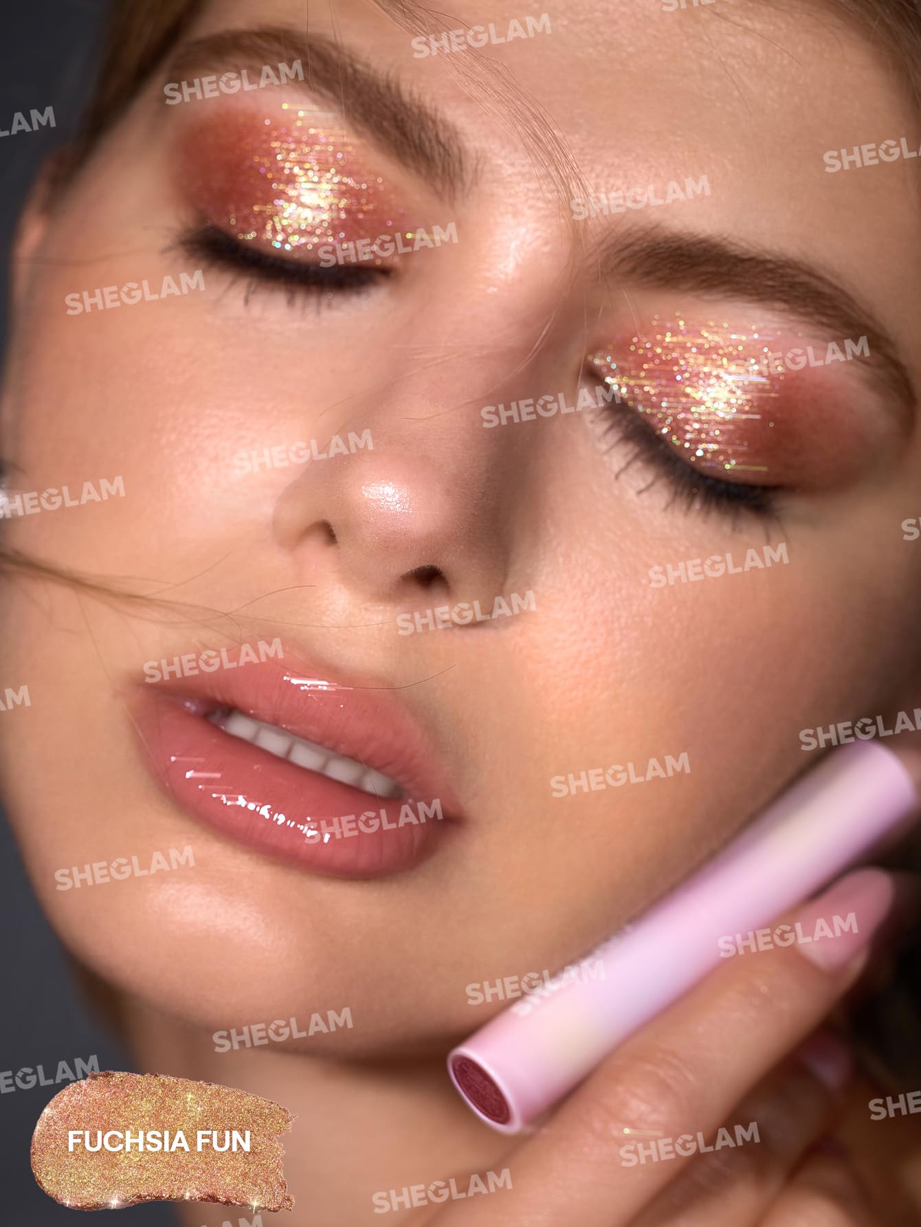 SHEGLAM Crystal Jelly Glaze Stick next to hand for size comparison and travel-friendly convenience