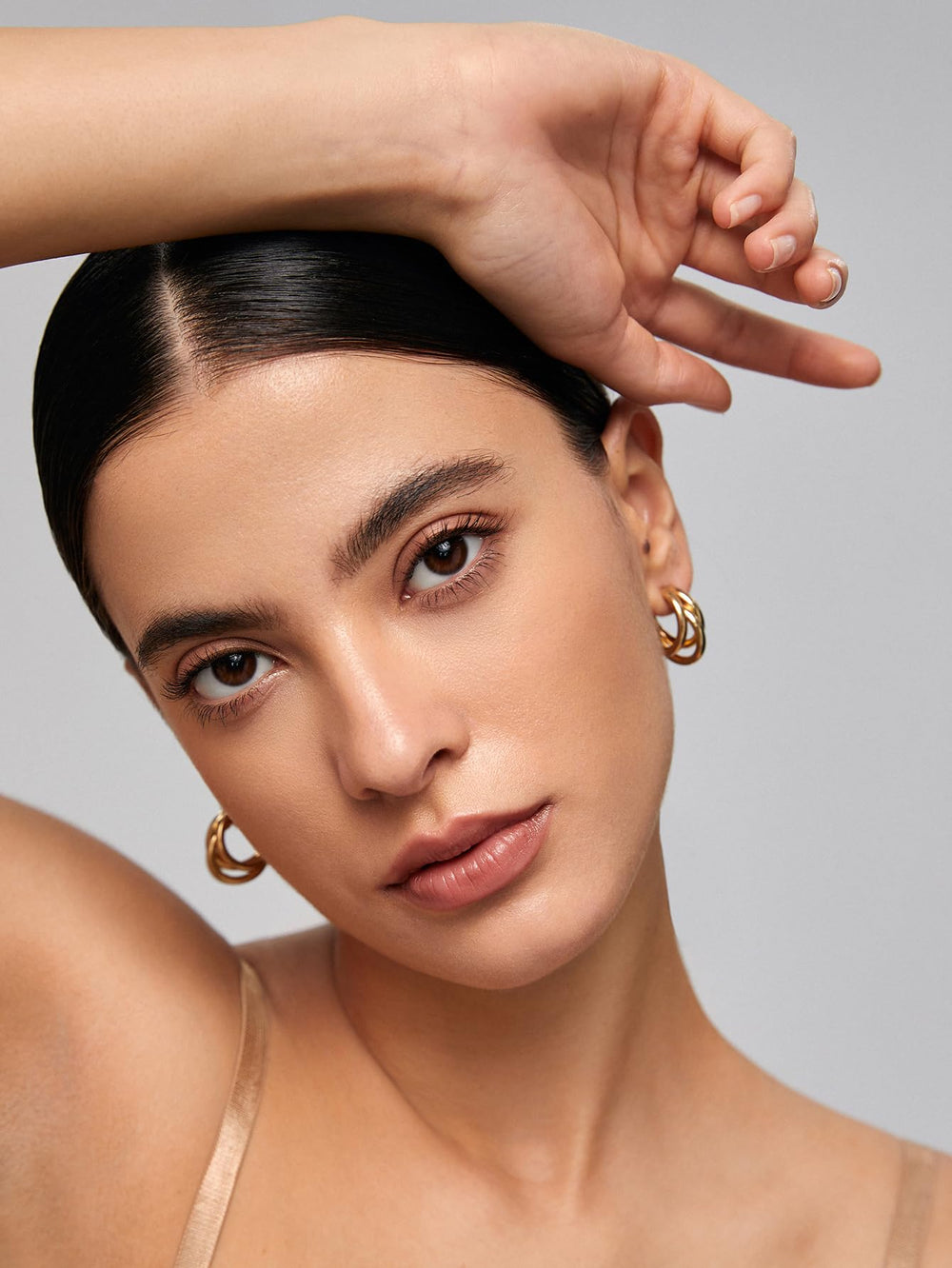 SHEGLAM lifestyle image of brow application showing defined natural look