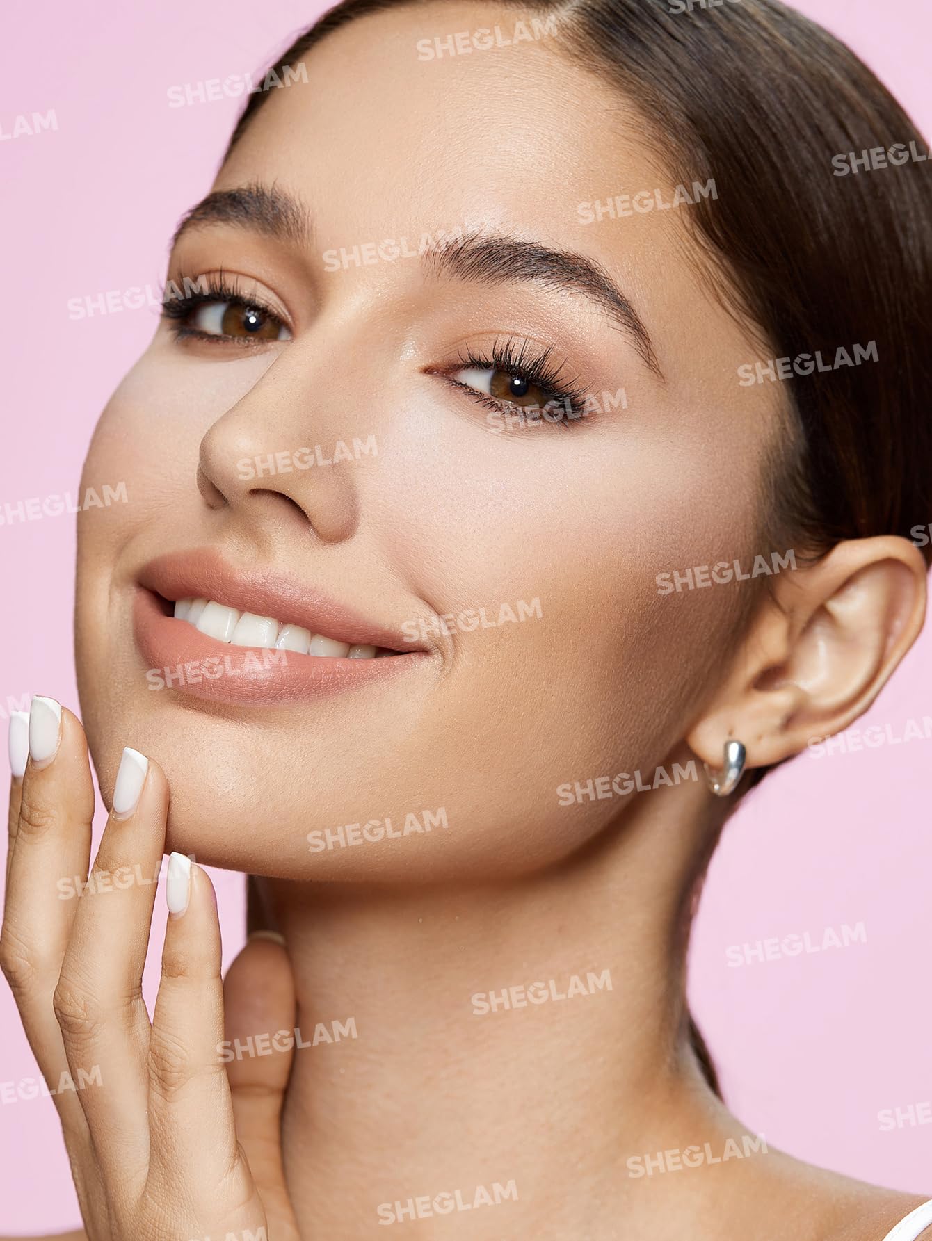 SHEGLAM applying under-eye powder to set and brighten quickly