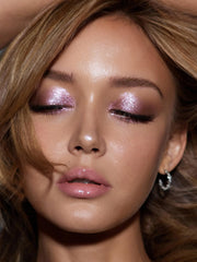 SHEGLAM Prismalight packaging in a vanity lifestyle shot communicating premium cruelty-free beauty