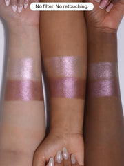SHEGLAM Prismalight duo next to hand for scale showing compact travel-ready convenience
