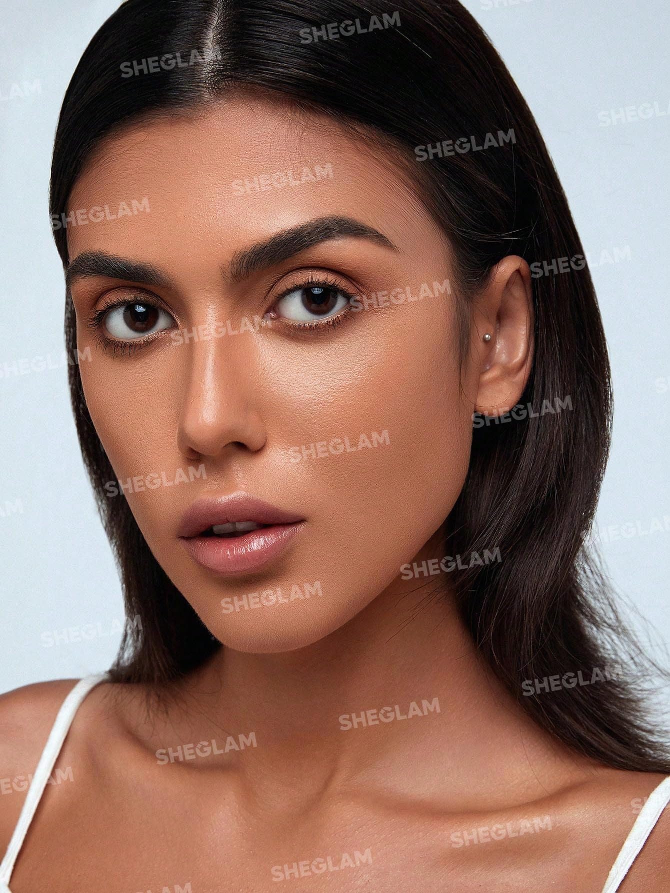 SHEGLAM open twist-up tip of stick revealing creamy applicator for precise lines