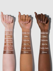 SHEGLAM bronzer in hand to show portable size and easy application
