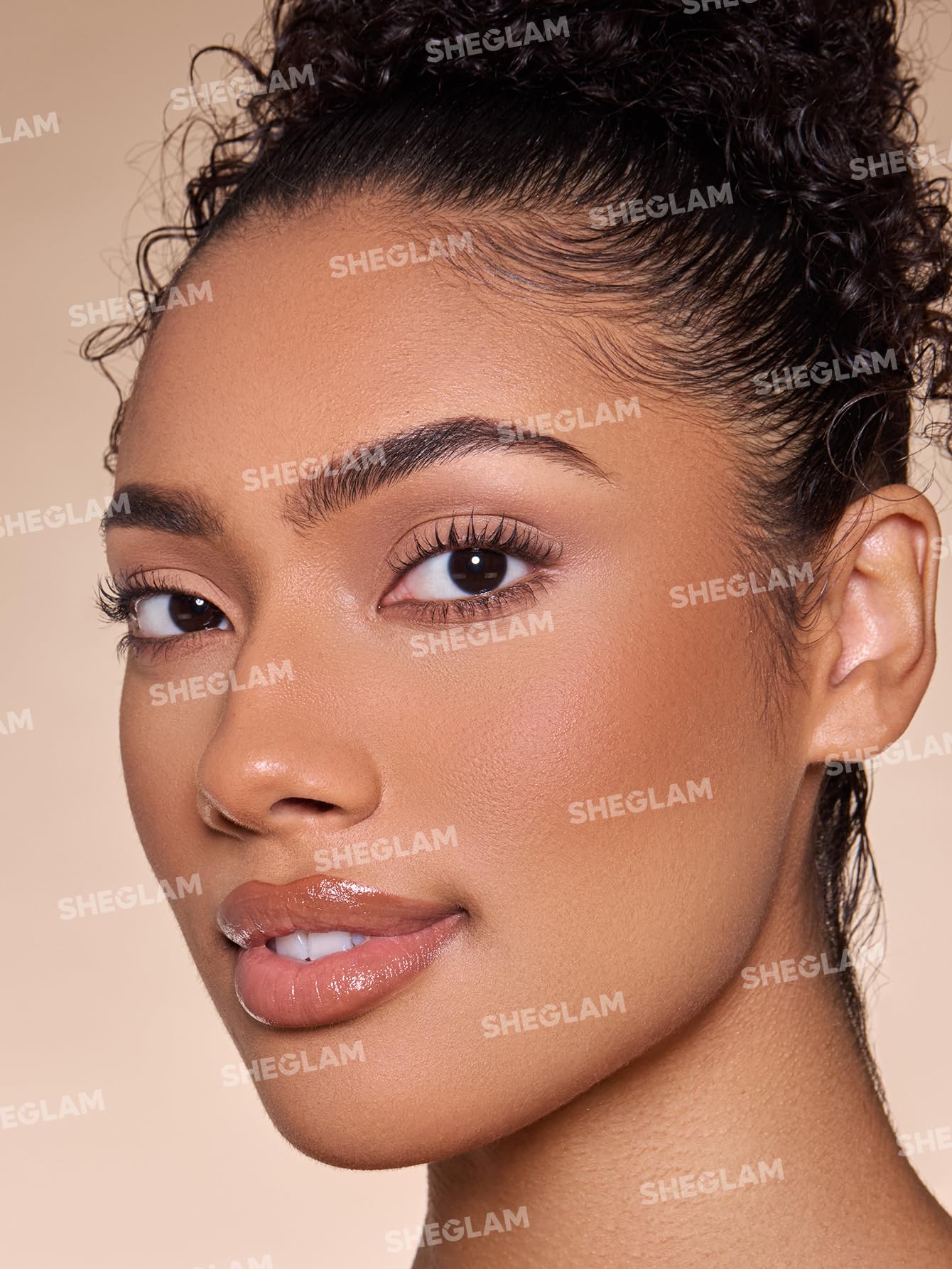SHEGLAM Umber applied on cheek for natural sculpting and warm glow
