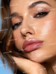 SHEGLAM Violet Fizz texture swatch on skin showing reflective micro-glitter