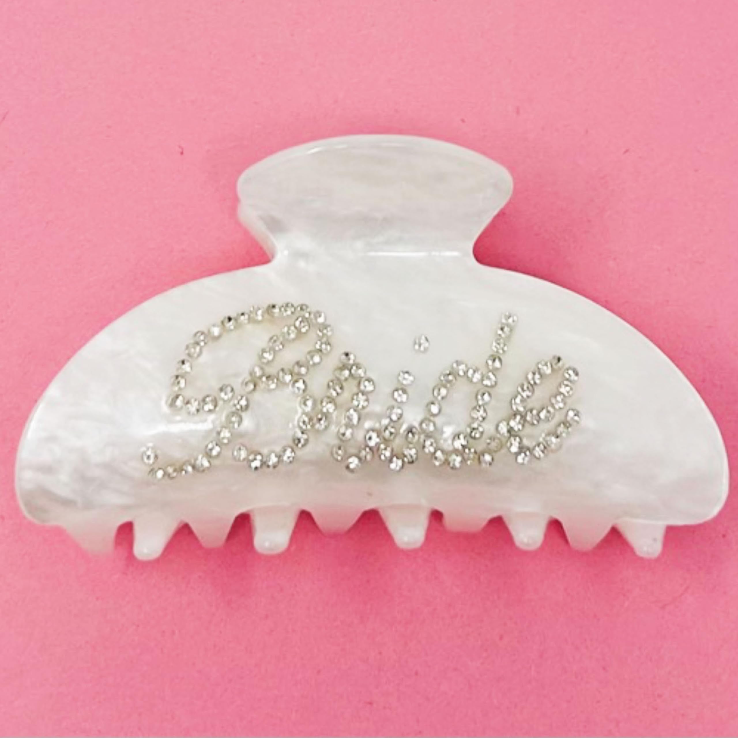 Shimmer Anna Shine held between fingers to show compact size and portability