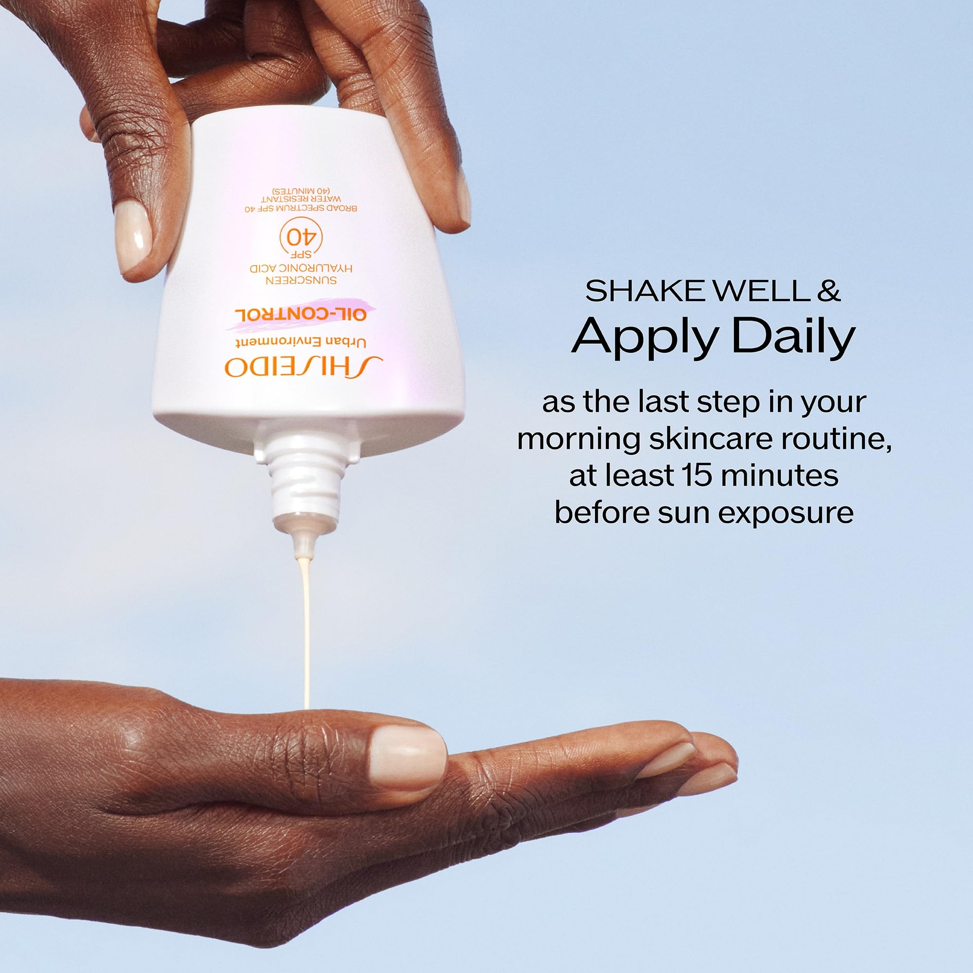 Shiseido 50 mL tube next to common items showing compact travel-friendly size