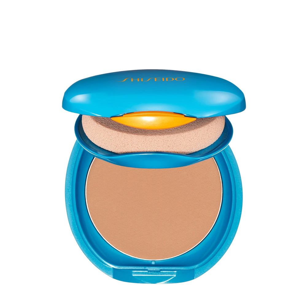 Shiseido refill placed in a compact case depicting travel-ready makeup and sun protection