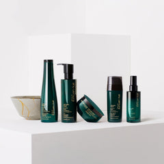 shu uemura lifestyle shelf in bathroom suggesting salon-quality home treatment benefits