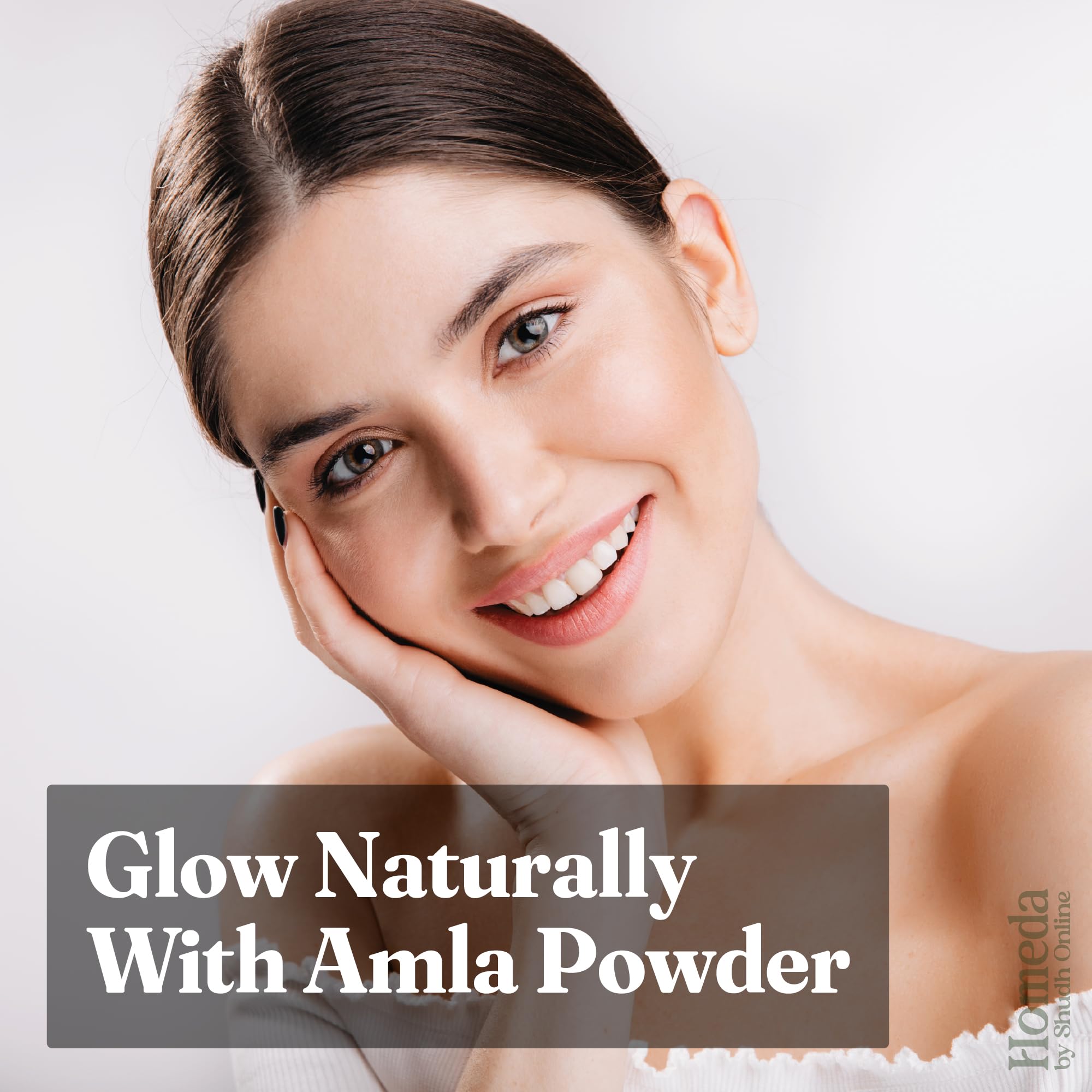 Shudh Online applying amla powder to scalp demonstrating even coverage