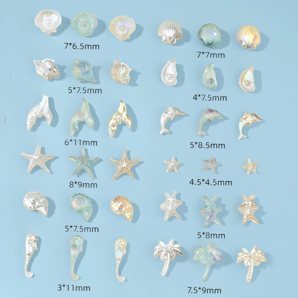 SHUXILIN charms applied on acrylic nail swatch showing beach style