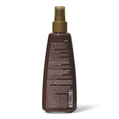 Silk Elements spray being used while blow-drying for smoother results