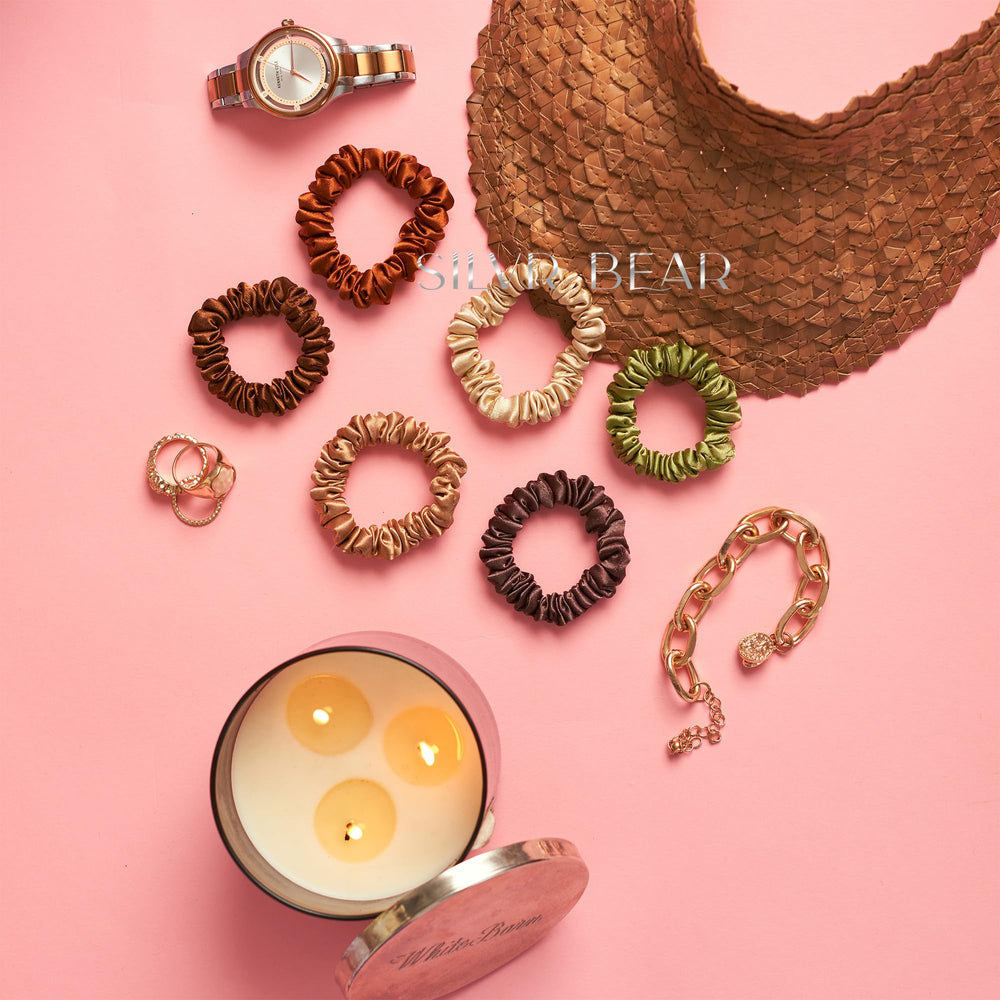 silvr bear scrunchie next to coin for size comparison showing compact profile