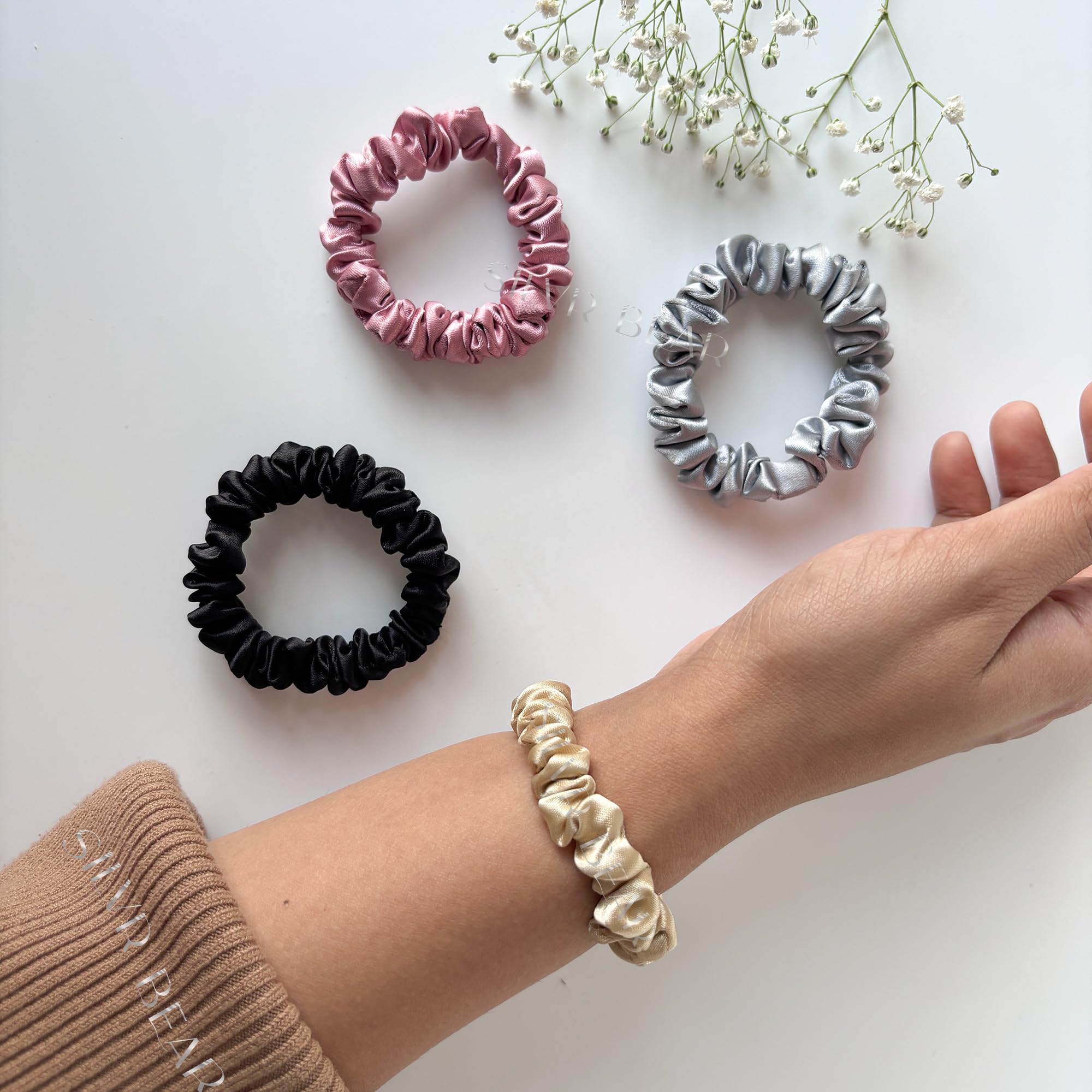 Silvr Bear scrunchies styled with an outfit to show color versatility and polish