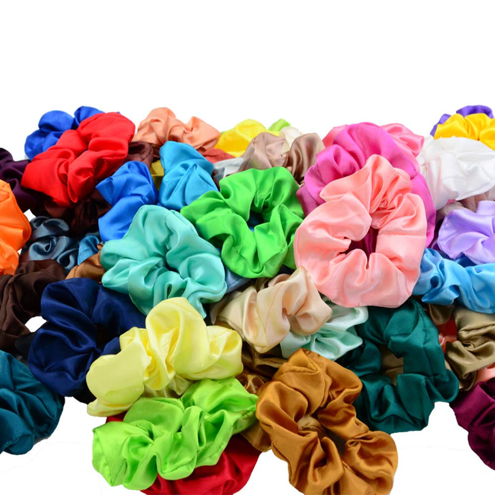 Simnice scrunchie held in hand illustrating large size and stretch for thick hair