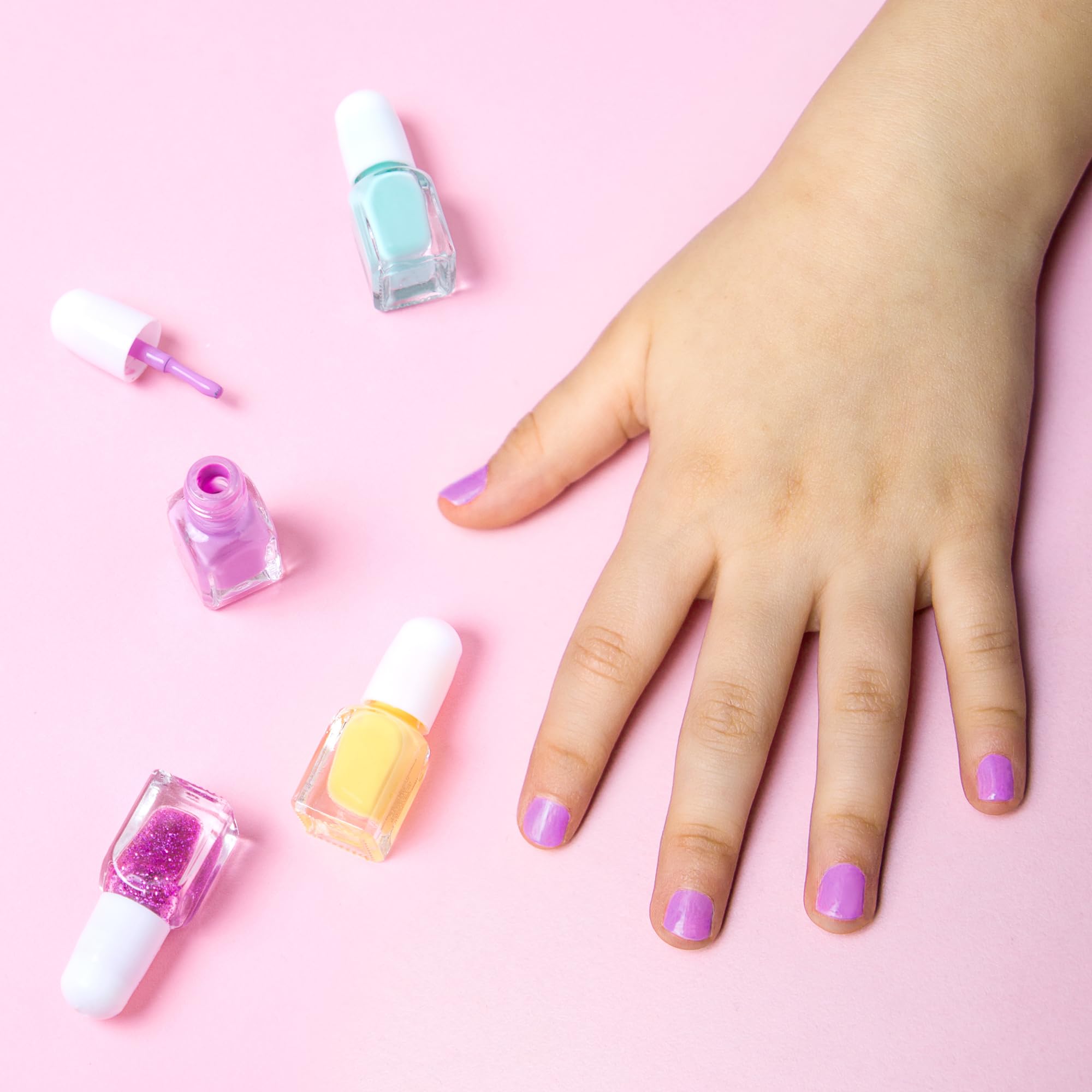SIMPLE PLEASURES kids enjoying a manicure together showing fun group activity