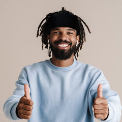 Sintege worn by model in bedroom, demonstrating protective overnight use and neat locks