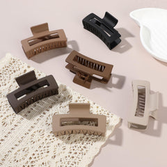 Sisiaipu clip next to a hand to show 3.5 inch size scale and comfortable fit