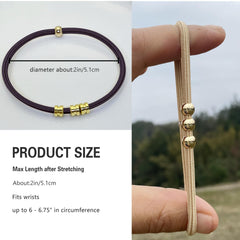 SISYOUP hair tie next to coin showing size and portability for daily use