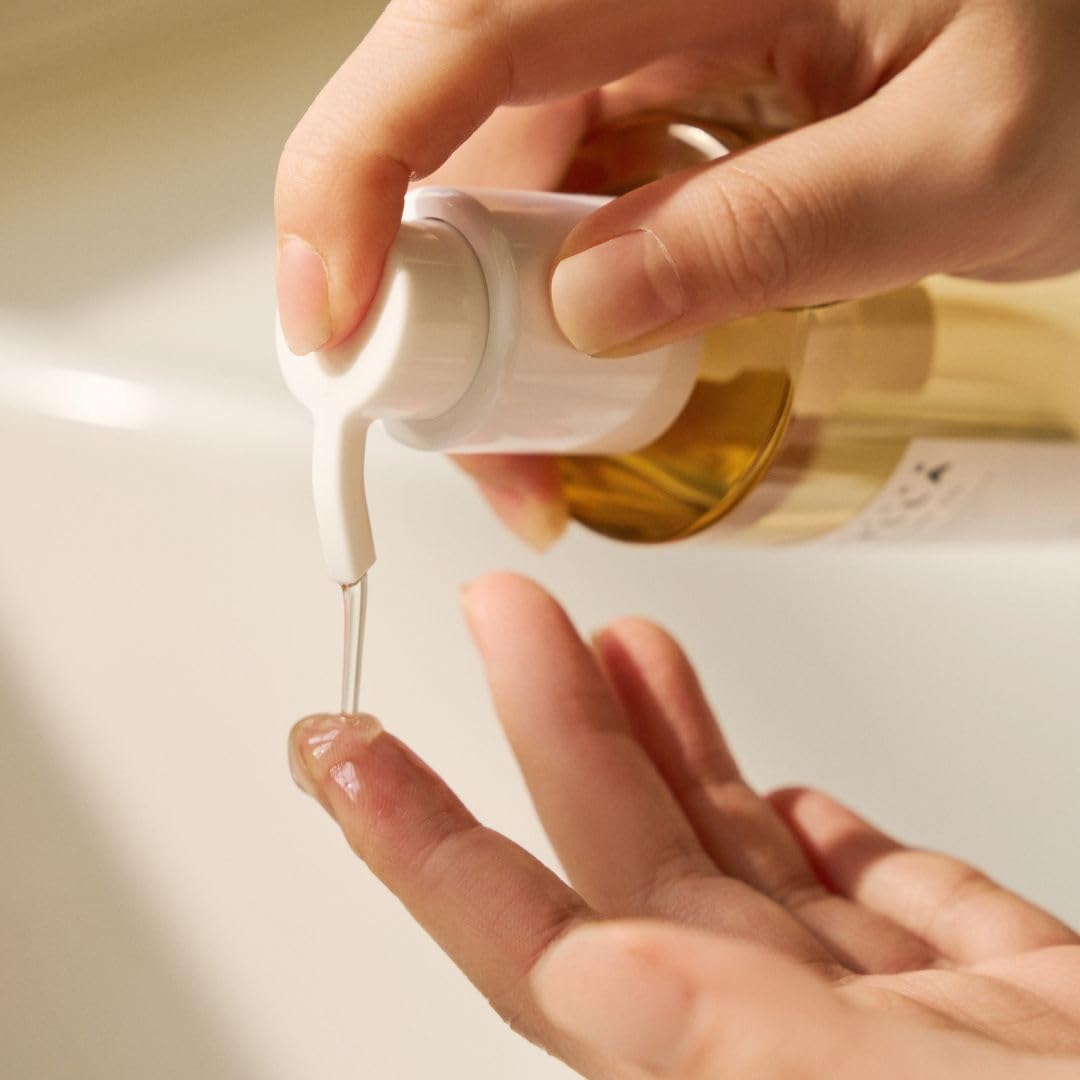 SKIN1004 cleansing oil on bathroom shelf with towel, suggesting daily skincare routine