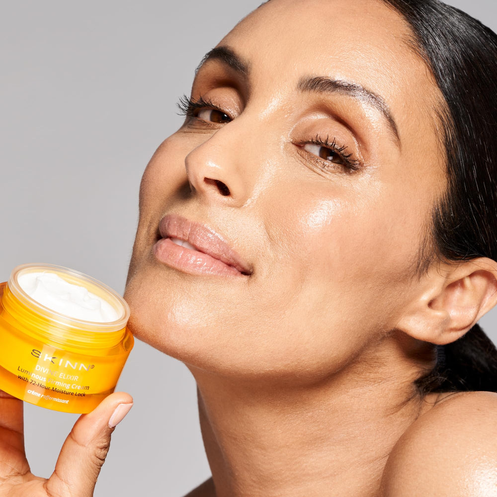 SKINN jar on vanity with towel and plant illustrating a calming skincare ritual