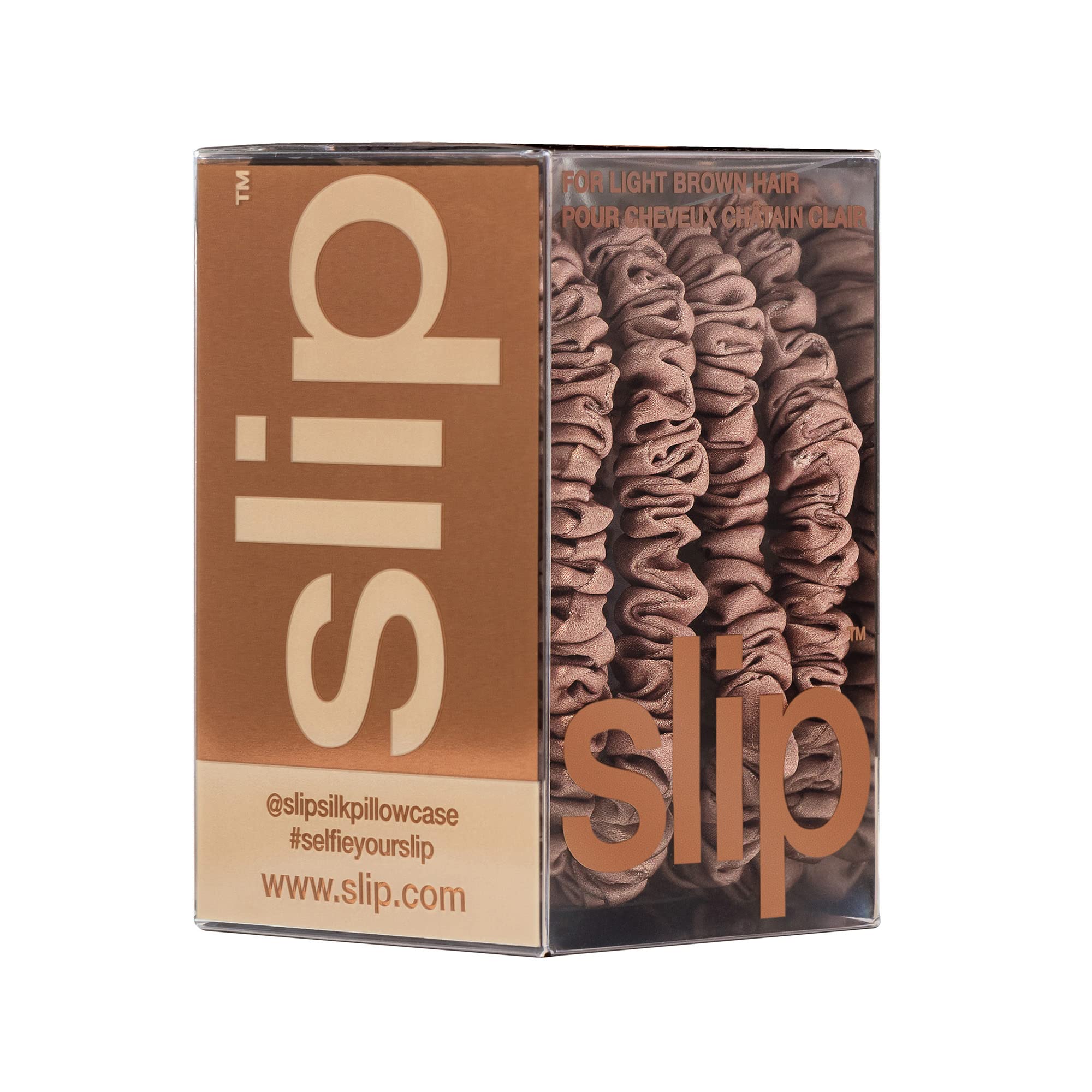 SLIP scrunchie under soft studio light highlighting glossy silk sheen