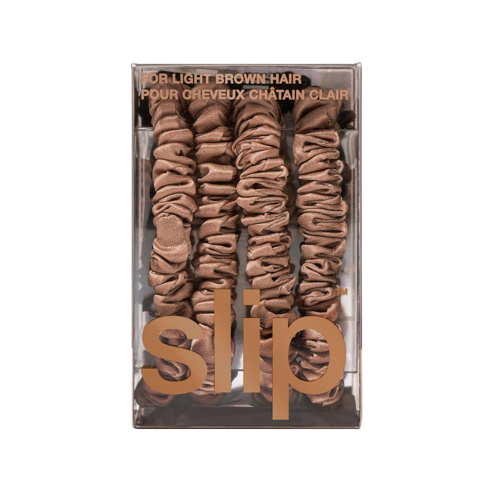 SLIP scrunchie near silk pillow suggesting overnight protection and less breakage